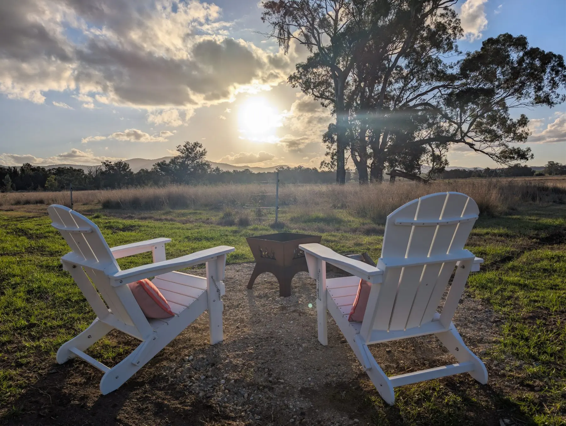 The firepit lit at sunset at Broke Estate