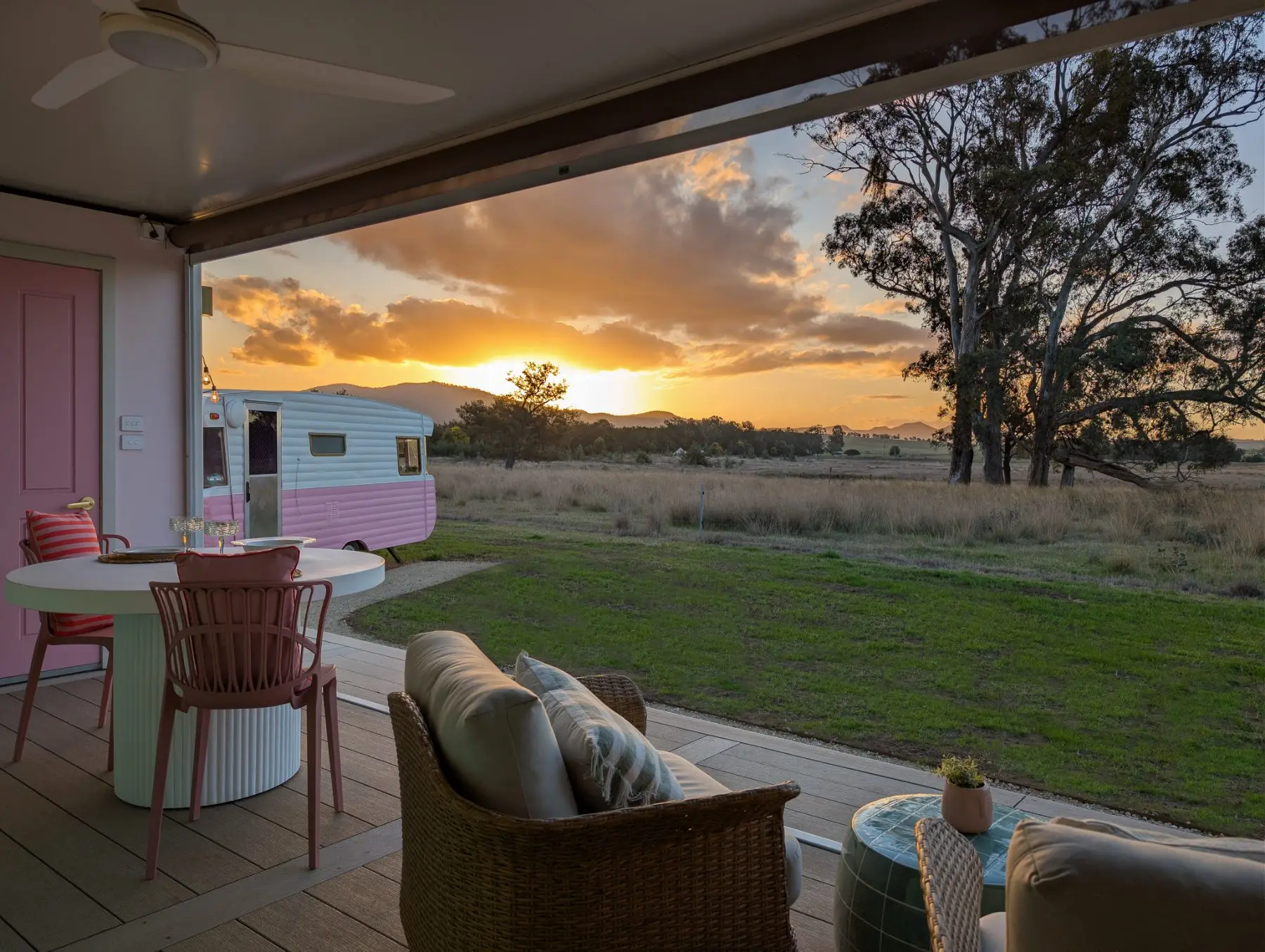 Sunset from the pavilion deck, the pink caravan and Yellow Rock beyond the paddock