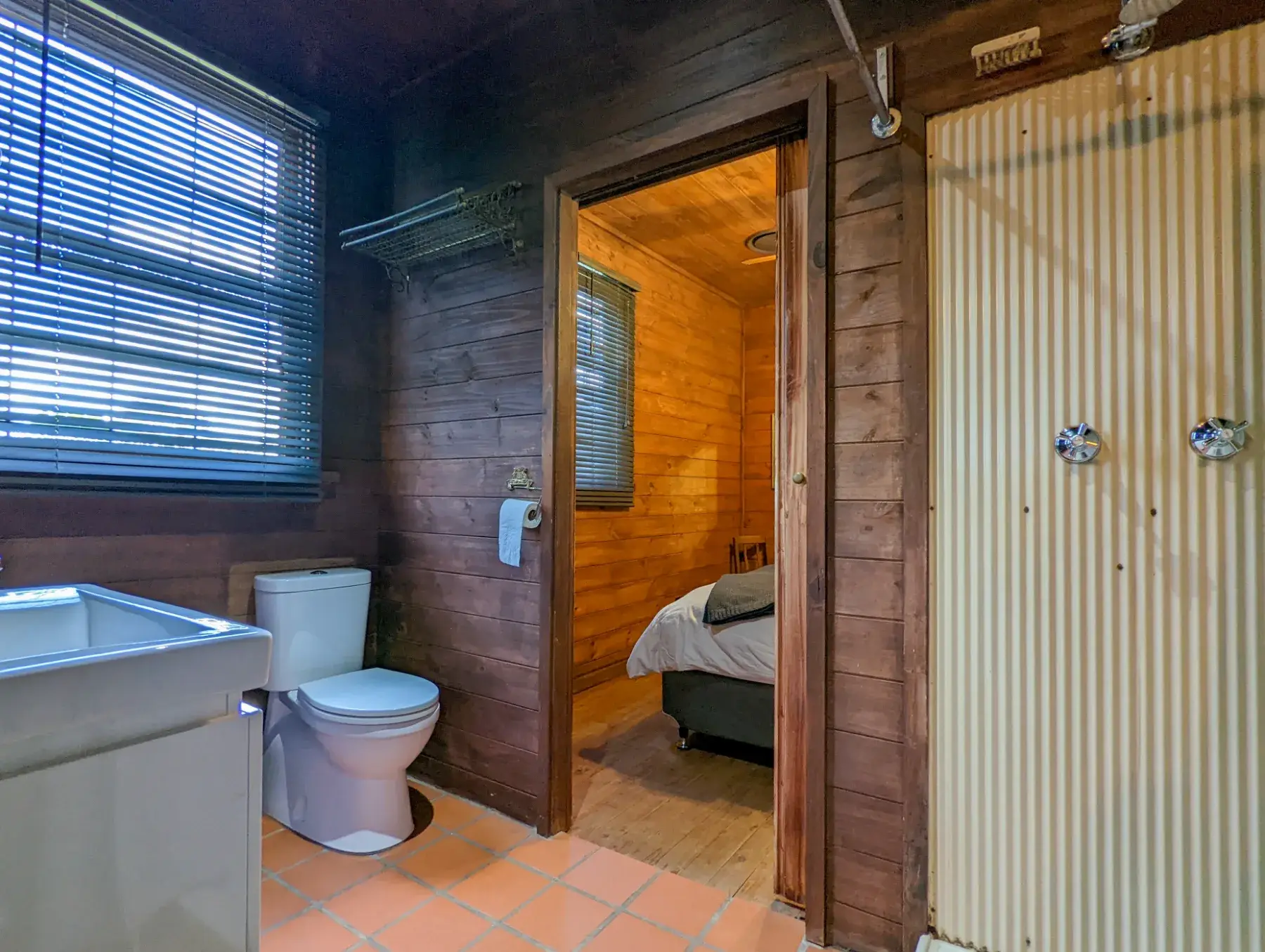 The second bathroom at the Cottage with a corrugated-iron shower