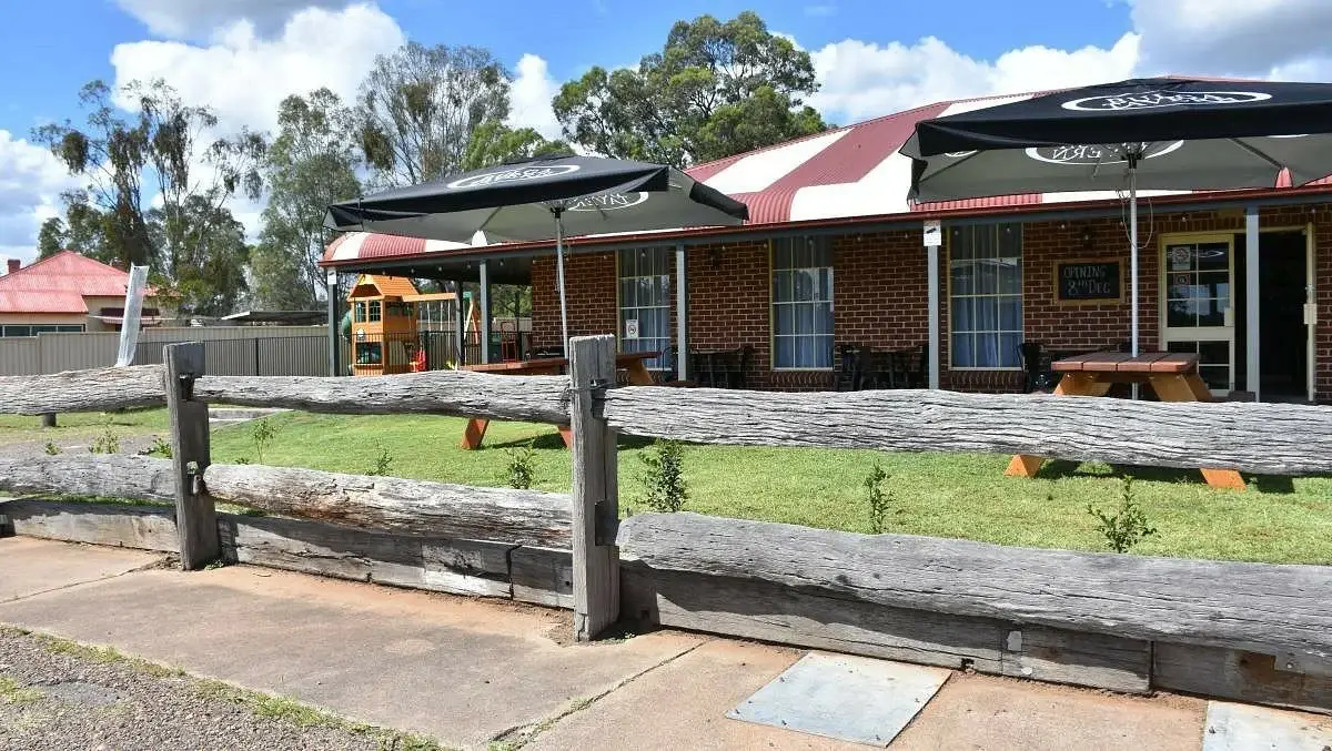 The Bulga Tavern from the roadside, umbrellas out front