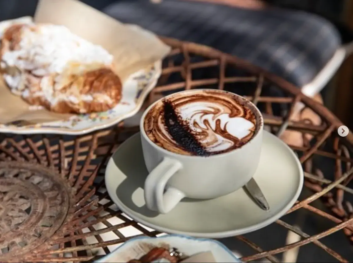 A cappuccino and a pastry at Magoony’s Coffee House in Broke